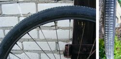 Fahrradreifen (Wulst) von DEKA. Bekannte Größen: 26x1.70. Reifen gekennzeichnet mit "HGW".