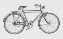 Katalogabbildung von 1957. Das dargestellte Fahrrad ist jedoch Baujahr 1956, es besitzt noch den mit einer Schelle befestigten Umlenkhebel hinterm Steuerkopf für die hintere Bremse.