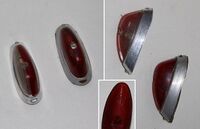 Zeitraum: Verwendung: Zubehörteil Material: Aluminium, Kunststoff Farben/Varianten:Plastikeinsatz rot oder zweigeteilt rot/transparent Bemerkungen:El-Me Symbol innen auf dem Plastikeinsatz