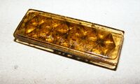 Gerader Pedalreflektor, verschiedene Gelbtöne bekannt, Material: Glas, mit reflektierendem Silberlack hinterlegt