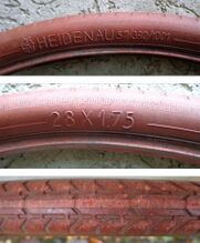 Zeitraum: frühe 1950er Jahre Größe: 28x1.75 Art: Drahtreifen Farbe: schwarz, rot (im Bild) Bemerkungen: